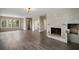 Living room with fireplace and hardwood floors at 1261 W Lakeshore Dr, Clermont, FL 34711