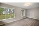 Spacious bedroom with water views and hardwood floors at 1261 W Lakeshore Dr, Clermont, FL 34711