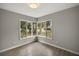 Spacious bedroom with hardwood floors and large windows at 1261 W Lakeshore Dr, Clermont, FL 34711