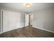 Bright bedroom featuring hardwood floors and ample closet space at 1261 W Lakeshore Dr, Clermont, FL 34711