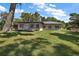 Charming single story home with a large backyard and waterfront views at 1261 W Lakeshore Dr, Clermont, FL 34711