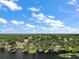Aerial view of waterfront homes and lake at 1261 W Lakeshore Dr, Clermont, FL 34711