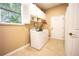 Laundry room with washer, dryer, and cabinets at 3554 County Road 216, Oxford, FL 34484
