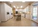 Spacious kitchen featuring white cabinets and a large island at 3554 County Road 216, Oxford, FL 34484