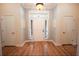 Bright and airy entryway with hardwood floors and built-in shelving at 3554 County Road 216, Oxford, FL 34484