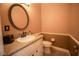 Small bathroom with toilet and vanity at 3554 County Road 216, Oxford, FL 34484