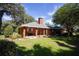 Brick home with covered patio and large backyard at 3554 County Road 216, Oxford, FL 34484