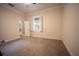 Comfortable bedroom with neutral decor and carpet flooring at 3554 County Road 216, Oxford, FL 34484