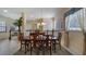 Bright dining room with a large table and hardwood chairs at 23 Camino Real Blvd # 23, Howey In The Hills, FL 34737