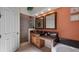 Primary bathroom with dual vanity, soaking tub, and a walk-in shower at 23 Camino Real Blvd # 23, Howey In The Hills, FL 34737