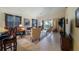 Living room with a partial kitchen view, featuring a sofa and armchairs at 23 Camino Real Blvd # 23, Howey In The Hills, FL 34737
