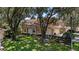 Two-story condo with attached garage and lush landscaping at 23 Camino Real Blvd # 23, Howey In The Hills, FL 34737