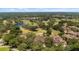 Aerial view of homes nestled on a golf course at 23 Camino Real Blvd # 23, Howey In The Hills, FL 34737