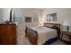 Cozy bedroom with wood furniture and natural light at 23 Camino Real Blvd # 23, Howey In The Hills, FL 34737
