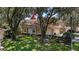 Exterior view of the house with landscaping at 23 Camino Real Blvd # 23, Howey In The Hills, FL 34737