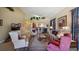 Elegant living room with a view of the kitchen, featuring comfortable seating and a neutral color scheme at 23 Camino Real Blvd # 23, Howey In The Hills, FL 34737