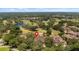 Aerial view showing home location on golf course at 23 Camino Real Blvd # 23, Howey In The Hills, FL 34737