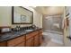 Bathroom with granite vanity and shower/tub combo at 23 Camino Real Blvd # 23, Howey In The Hills, FL 34737