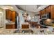 Well-equipped kitchen with granite countertops and stainless steel appliances at 23 Camino Real Blvd # 23, Howey In The Hills, FL 34737