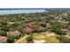 Aerial view of property highlighting its location near the lake at 23 Camino Real Blvd # 23, Howey In The Hills, FL 34737