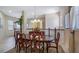 Bright dining room with a large table and hardwood chairs at 23 Camino Real Blvd # 23, Howey In The Hills, FL 34737