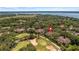 Aerial view showcasing home's location in a golf course community near the lake at 23 Camino Real Blvd # 23, Howey In The Hills, FL 34737