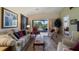 Spacious living room with comfortable seating and golf course view at 23 Camino Real Blvd # 23, Howey In The Hills, FL 34737