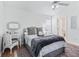 Bright bedroom with a queen-size bed, and a vanity area at 1405 W Schwartz Blvd, The Villages, FL 32159