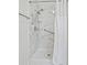 Walk-in shower with marble surround and grab bars at 1405 W Schwartz Blvd, The Villages, FL 32159