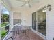 Relaxing screened porch with brick floor and outdoor seating at 1405 W Schwartz Blvd, The Villages, FL 32159