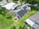 Aerial view of home with solar panels and patio, located in a residential neighborhood at 1405 W Schwartz Blvd, The Villages, FL 32159