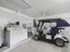 Garage with washer, dryer, and golf cart at 1405 W Schwartz Blvd, The Villages, FL 32159