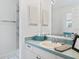 Clean bathroom with light teal vanity and walk-in shower at 1405 W Schwartz Blvd, The Villages, FL 32159