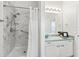 Bathroom with walk-in shower, grab bars, and linen storage at 1405 W Schwartz Blvd, The Villages, FL 32159
