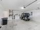 Garage with washer, dryer, golf cart, and extra storage at 1405 W Schwartz Blvd, The Villages, FL 32159