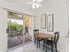 Cozy breakfast nook with table and chairs, near sliding glass doors at 1405 W Schwartz Blvd, The Villages, FL 32159