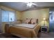Cozy bedroom with a ceiling fan and ample natural light at 1306 Westland Dr, Tavares, FL 32778