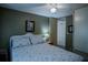 Second bedroom with a ceiling fan and neutral color palette at 1306 Westland Dr, Tavares, FL 32778