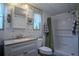 Clean bathroom with shower/tub combo and nautical-themed decor at 1306 Westland Dr, Tavares, FL 32778