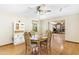 Bright dining room with hardwood floors and view into living room at 4242 Griffin View Dr, Lady Lake, FL 32159