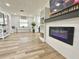 Living room featuring a modern fireplace and built-in shelving at 14598 Sw 34Th Terrace Rd, Ocala, FL 34473