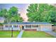 Charming ranch home with landscaped lawn and updated facade at 14598 Sw 34Th Terrace Rd, Ocala, FL 34473