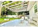 Relaxing patio area with pergola and seating at 14598 Sw 34Th Terrace Rd, Ocala, FL 34473