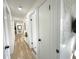 Clean hallway with light walls and wood-look flooring at 14598 Sw 34Th Terrace Rd, Ocala, FL 34473