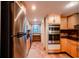 Bright kitchen boasts stainless steel appliances and ample cabinetry at 601 W Old Hwy 441 # 11B, Mount Dora, FL 32757