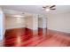 Hardwood floor living room with access to other rooms at 601 W Old Hwy 441 # 11B, Mount Dora, FL 32757