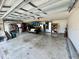 Spacious two-car garage with extra storage and workshop area at 12046 Ne 51St Cir, Oxford, FL 34484