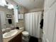 Small bathroom with a shower/tub combo and vanity at 12046 Ne 51St Cir, Oxford, FL 34484
