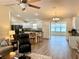 Spacious kitchen with white cabinets, granite countertops, and stainless steel appliances at 12046 Ne 51St Cir, Oxford, FL 34484