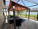 Covered patio and screened enclosure, great for outdoor relaxation at 12046 Ne 51St Cir, Oxford, FL 34484